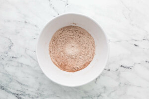 Mixing the dry ingredients in a bowl.